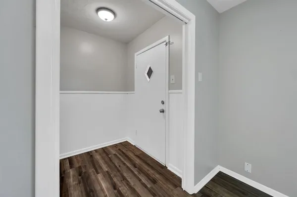 a bathroom with a sink toilet a mirror and shower