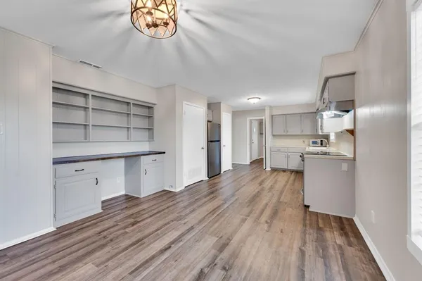a view of kitchen and wooden floor