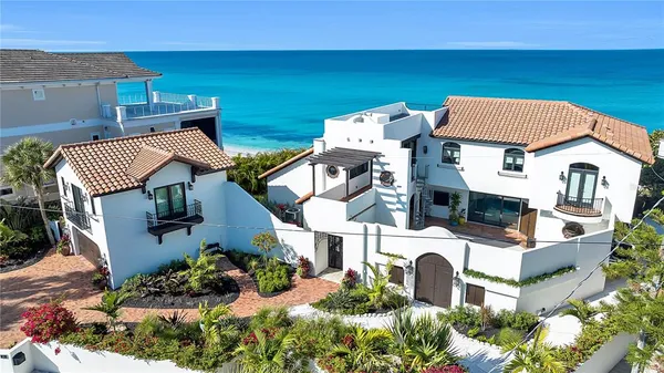 an aerial view of a house with outdoor space