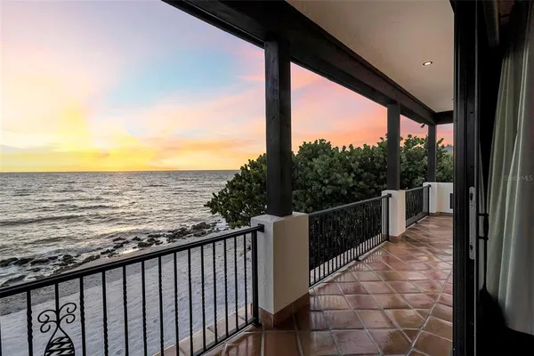 a work room with wooden floor and windows