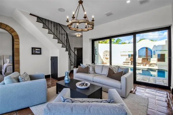 a spacious bedroom with a bed and a painting on the wall