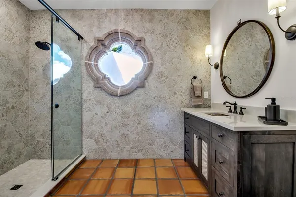 a view of a house with a small yard and plants