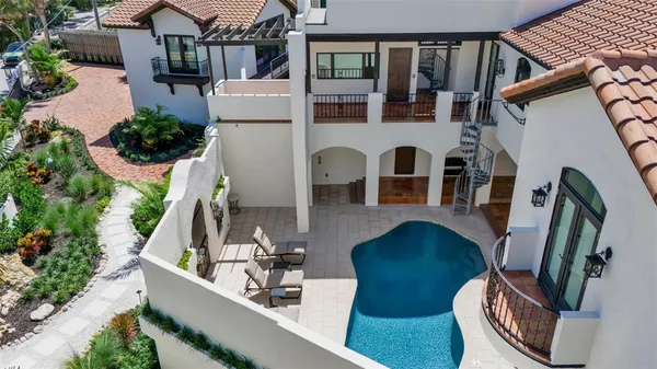 a living room with furniture ceiling fan and a rug