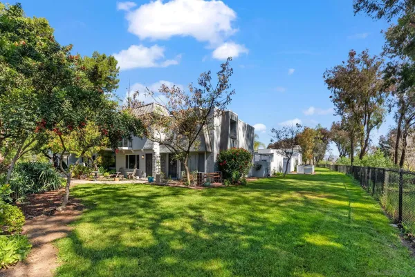 a front view of a building with garden