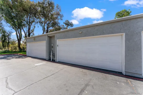 a view of a park with large trees