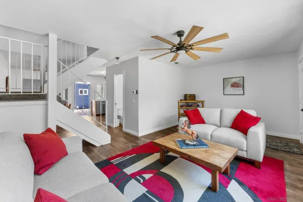 a living room with furniture and a rug