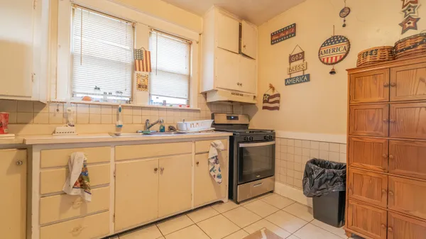 a kitchen with stainless steel appliances a sink and a stove