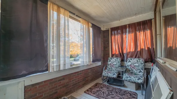 a room with window and furniture