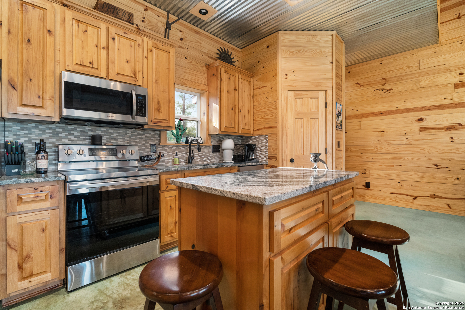 1110 Grandview Circle Bandera, TX 78003 - Photo 12 of 45 a kitchen with a sink cabinets and a stove top oven