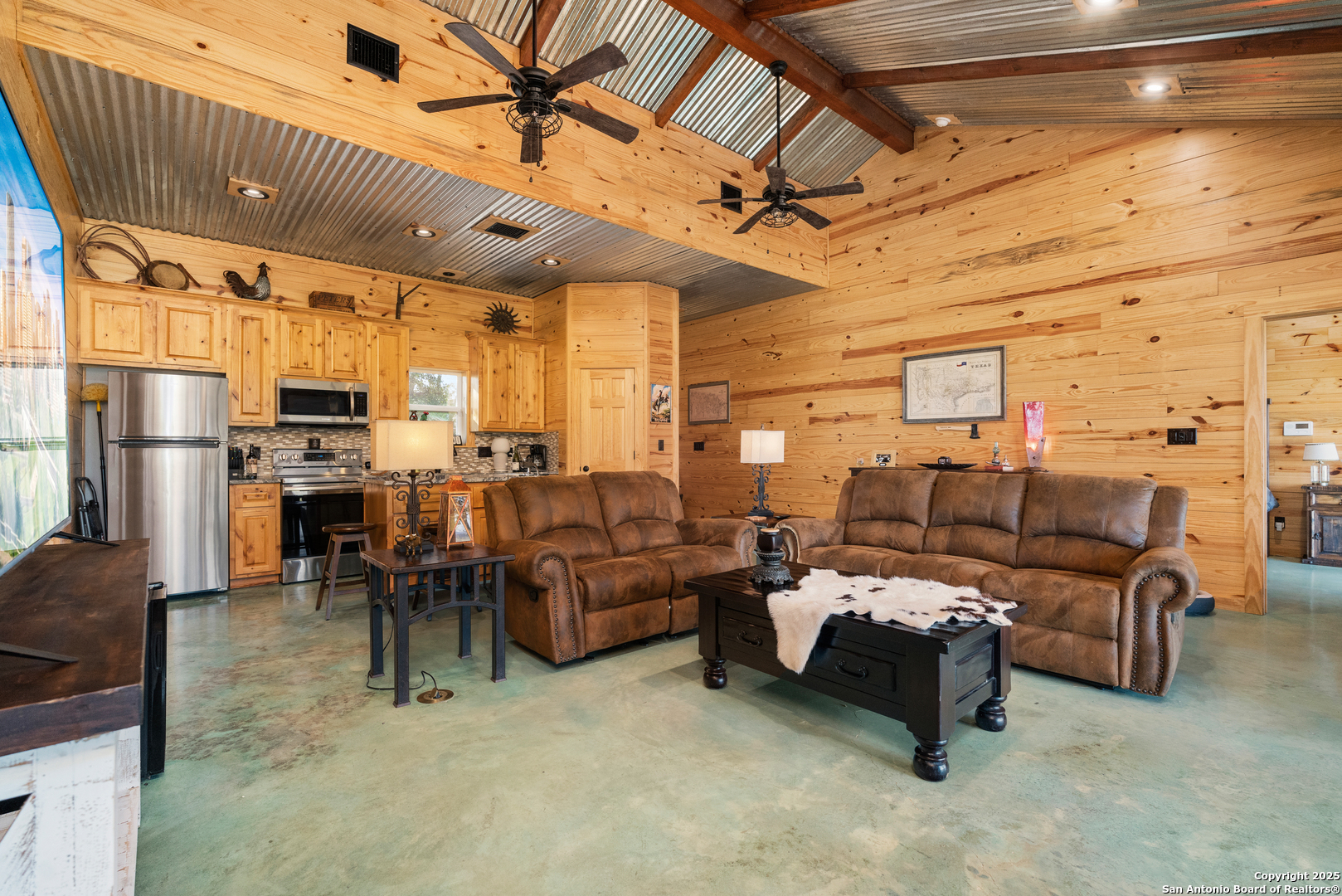1110 Grandview Circle Bandera, TX 78003 - Photo 10 of 45 a living room with lots of furniture and a chandelier