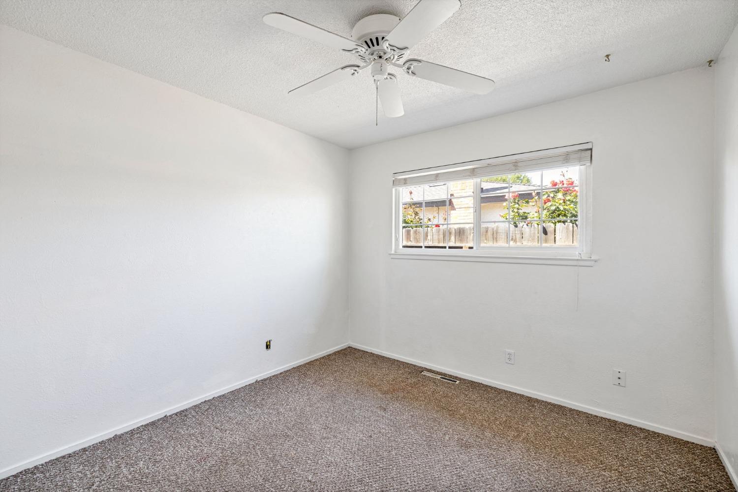 1345 Peach Avenue Clovis, CA 93612 - Photo 14 of 27 a view of an empty room with a window