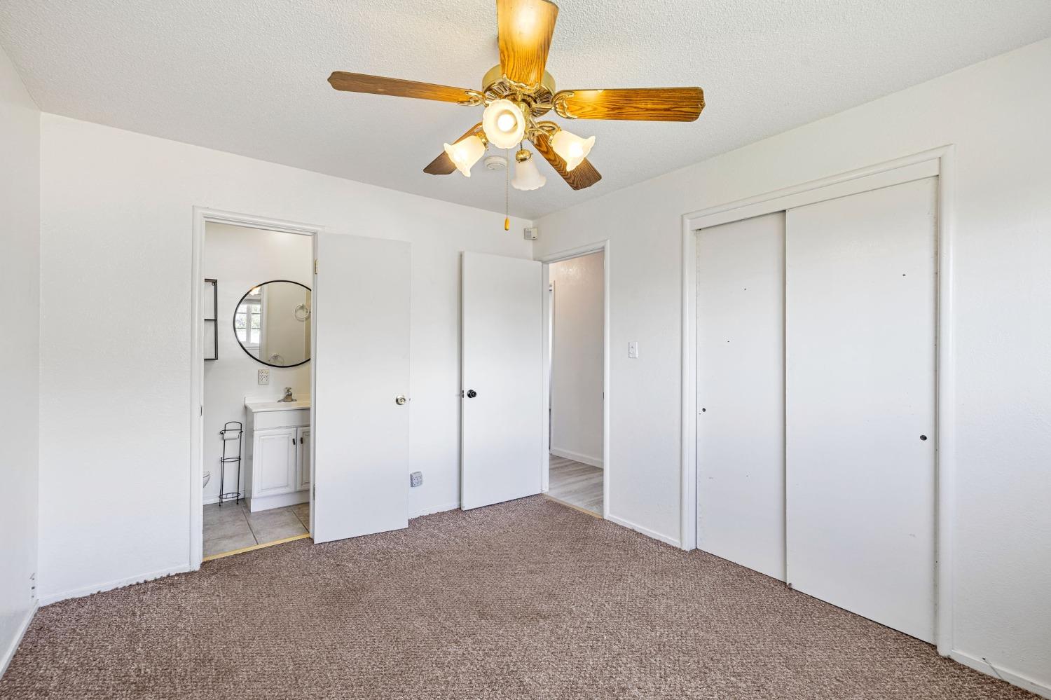 1345 Peach Avenue Clovis, CA 93612 - Photo 18 of 27 a view of an empty room and chandelier fan