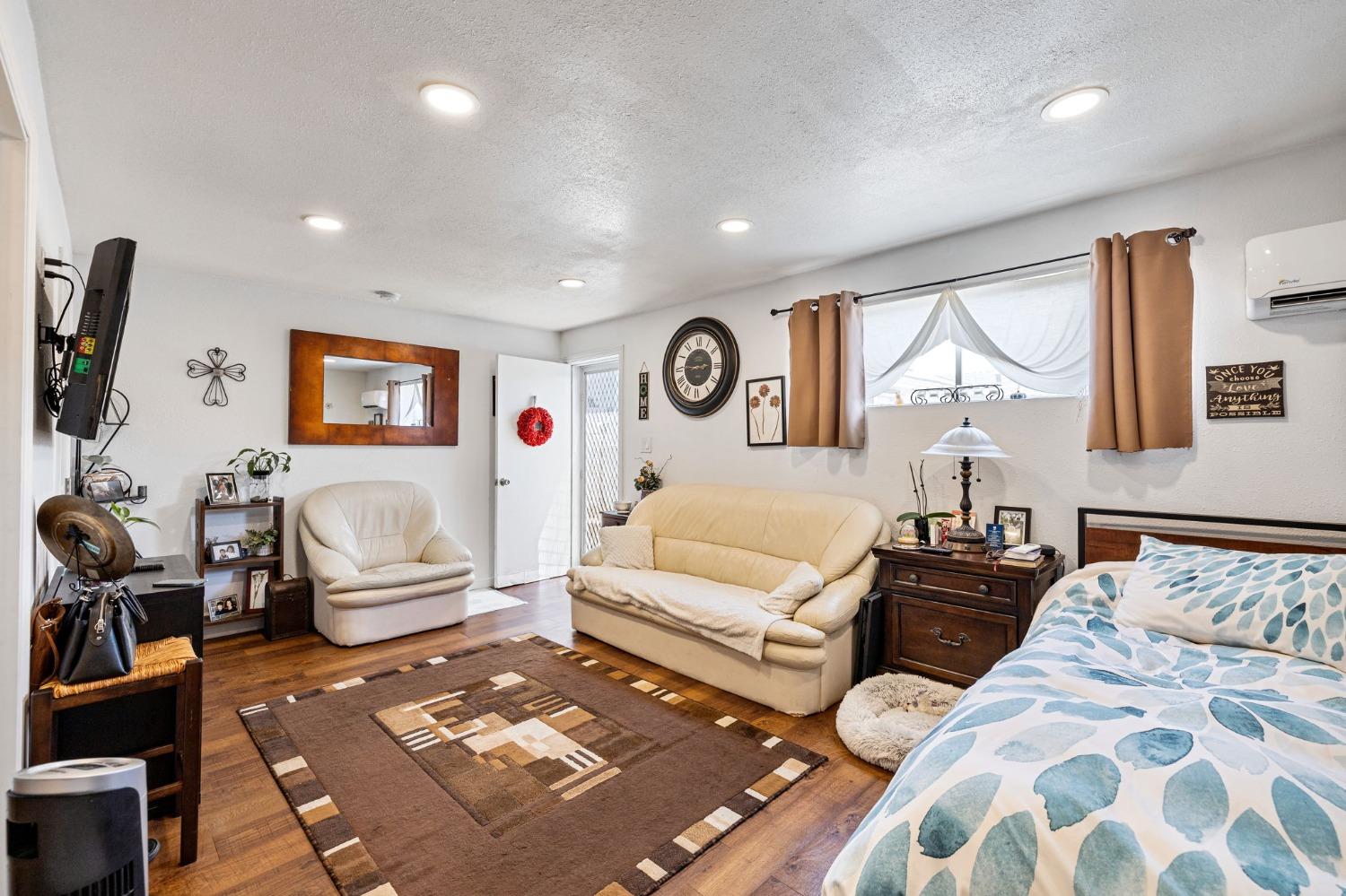 1345 Peach Avenue Clovis, CA 93612 - Photo 22 of 27 a bedroom with furniture and a large window