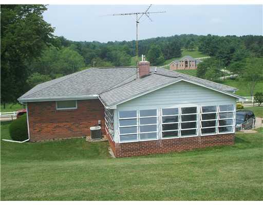 2746 South Bridge Road Washington, PA 15301 - Photo 2 of 14 Sunroom. Rear view showing the large sunroom
