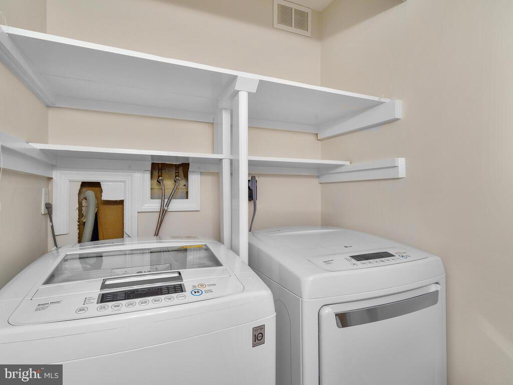 8214 Tory Road, Unit 141 Springfield, VA 22152 - Photo 20 of 38 Half bath downstairs with laundry