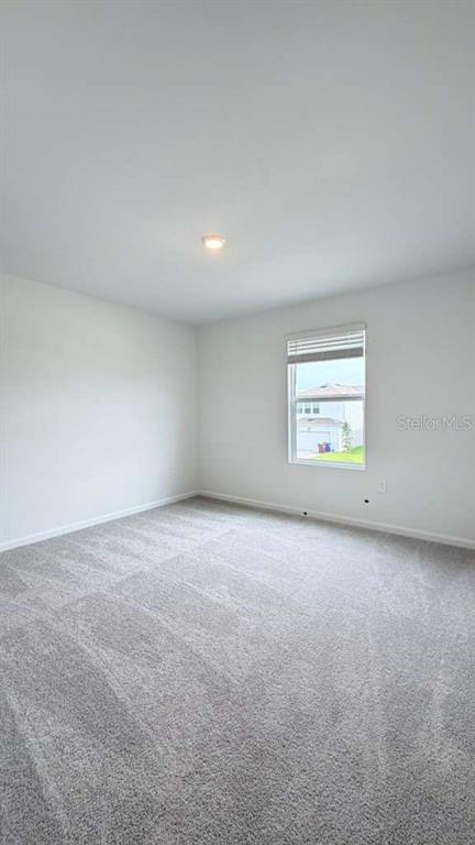 5174 Clay Whaley Road St. Cloud, FL 34772 - Photo 13 of 25 an empty room with a window