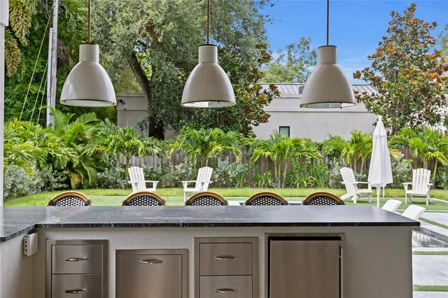 a view of a backyard with swimming pool