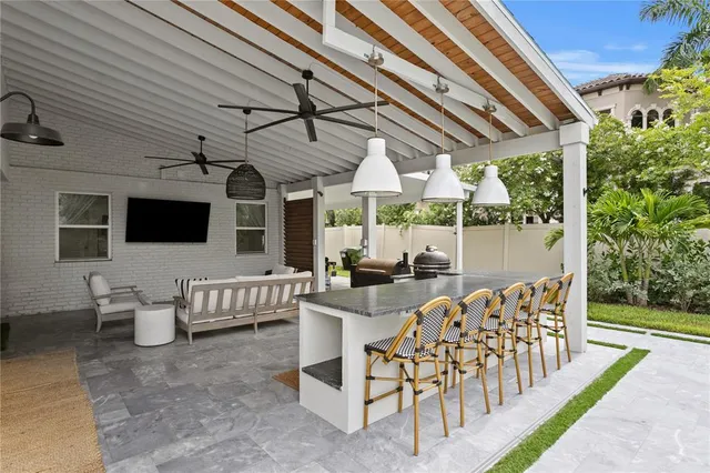 a view of a house with a yard patio and sitting area