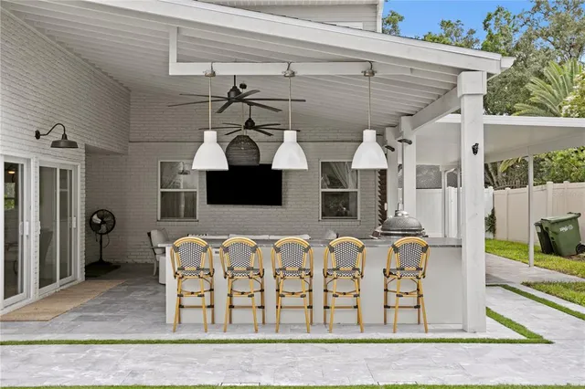 a bedroom with bed and a chandelier