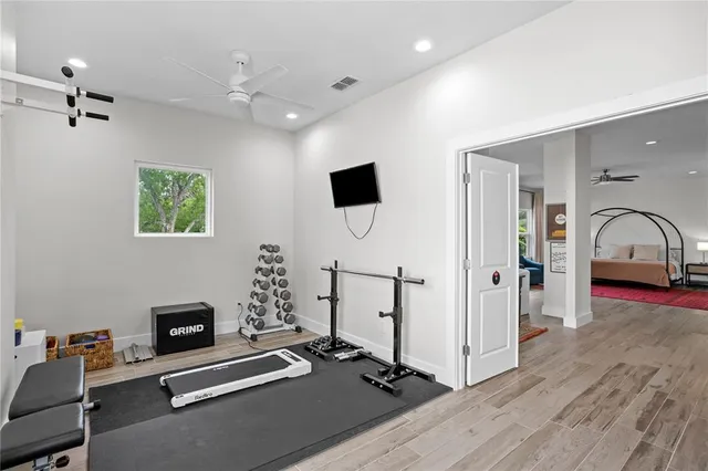 a view of a closet area with racks on the wall