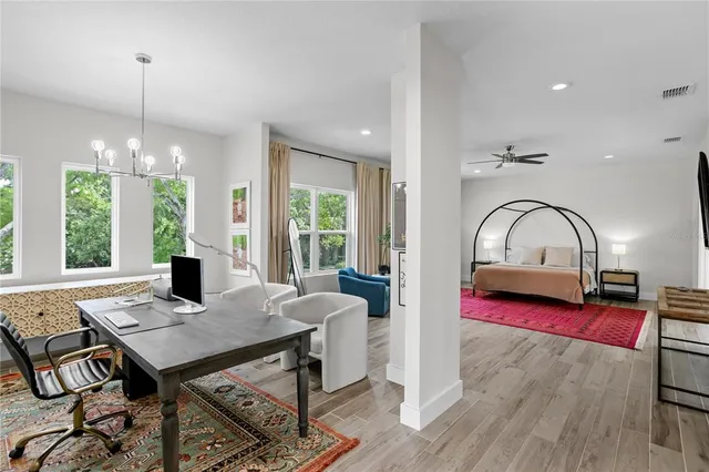 an aerial view of a house with garden space and street view