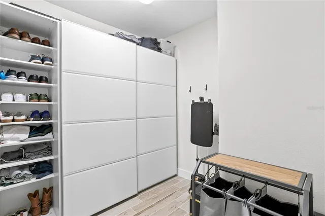 an aerial view of residential houses with outdoor space and trees