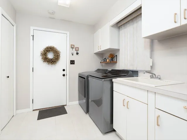 a kitchen with a sink and a stove
