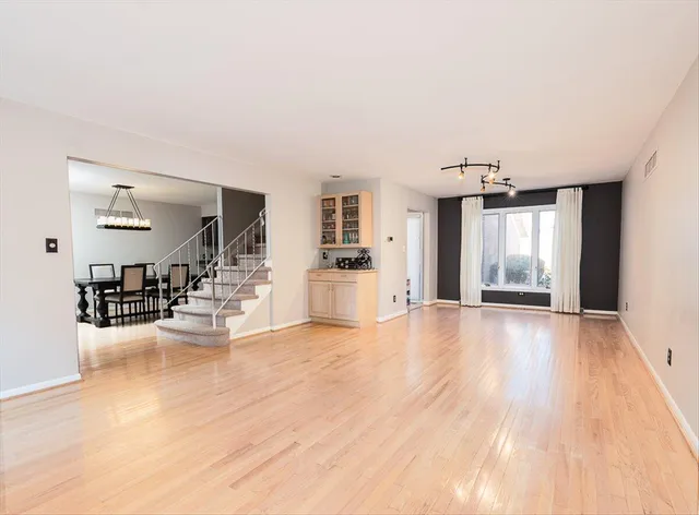 a view of a livingroom with kitchen and furniture