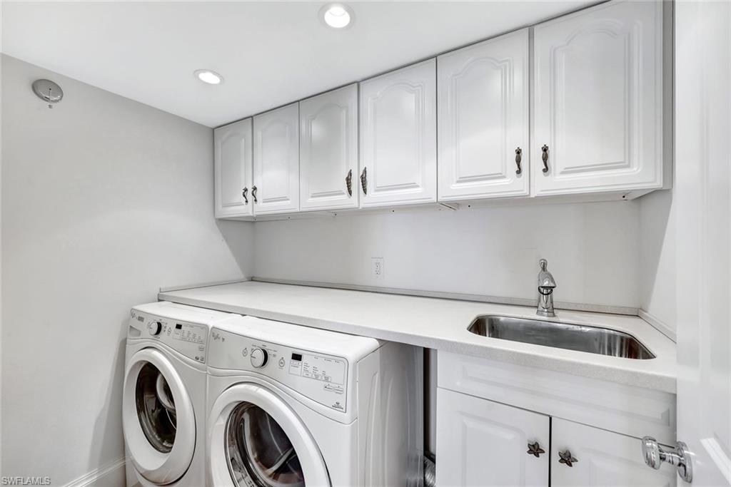 4451 Gulf Shore Boulevard North, Unit 506 Naples, FL 34103 - Photo 19 of 32 a view of cabinets and sink