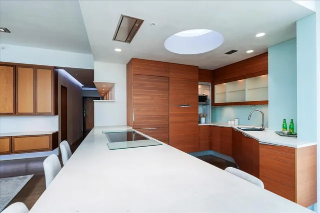 a kitchen with a sink and a refrigerator