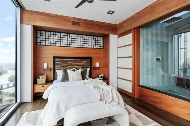 a bedroom with a bed and a window