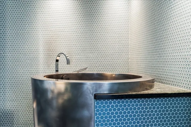 a bathroom with a sink and shower