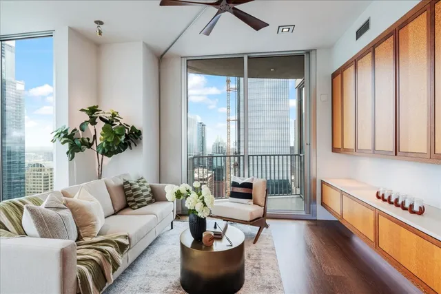 a living room with furniture and a large window
