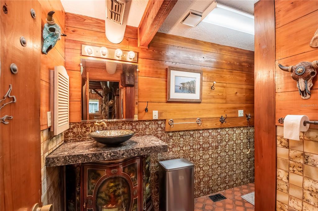 15615 Northeast 21st Avenue Road Citra, FL 32113 - Photo 13 of 98 a bathroom with a granite countertop sink a mirror and shower