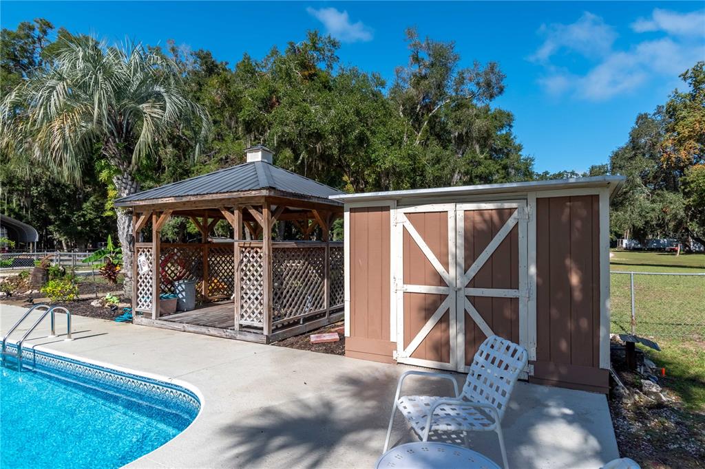 15615 Northeast 21st Avenue Road Citra, FL 32113 - Photo 39 of 98 an outdoor space with swimming pool and furniture