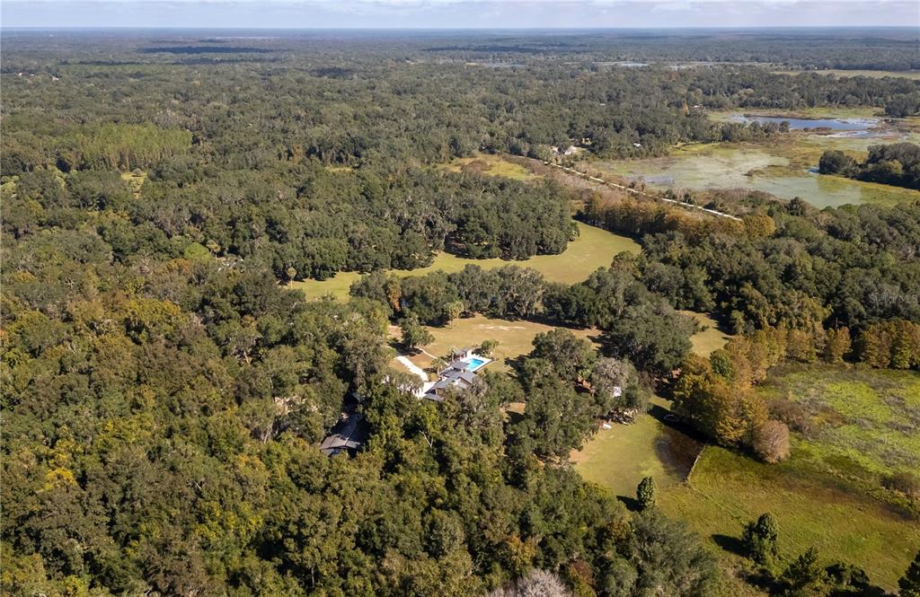 15615 Northeast 21st Avenue Road Citra, FL 32113 - Photo 90 of 98 an aerial view of a houses with a lake view