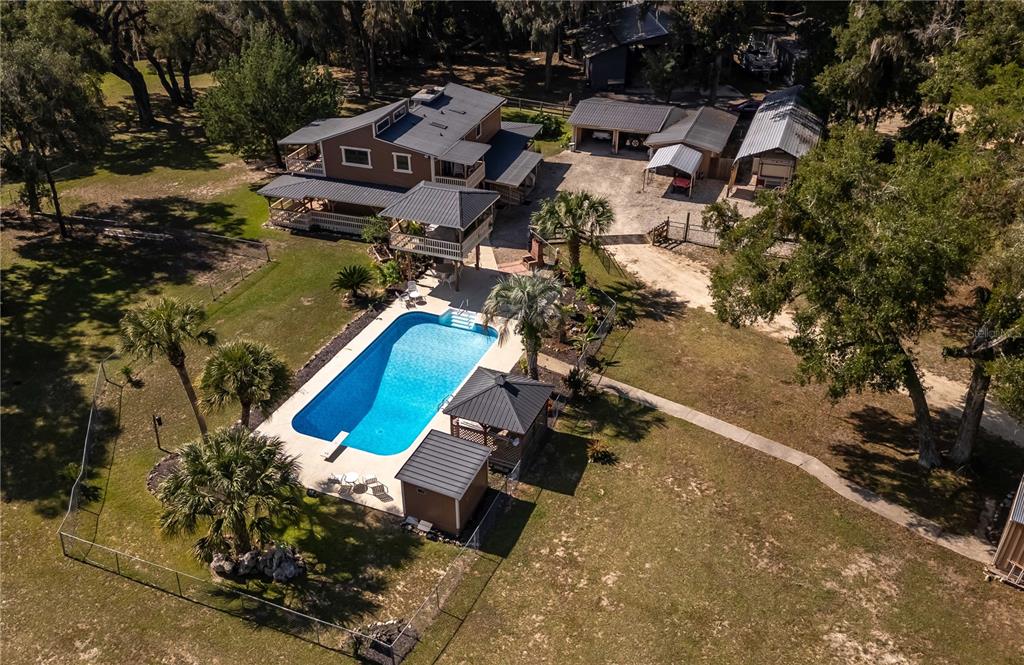 15615 Northeast 21st Avenue Road Citra, FL 32113 - Photo 94 of 98 an aerial view of a house with a swimming pool and outdoor space