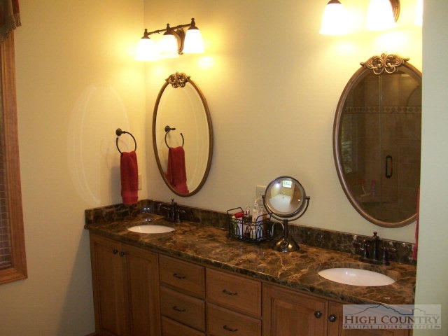186 Harper Trail Boone, NC 28607 - Photo 23 of 46 a bathroom with a sink and a mirror