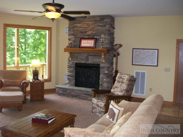 186 Harper Trail Boone, NC 28607 - Photo 30 of 46 a living room with furniture and a fireplace
