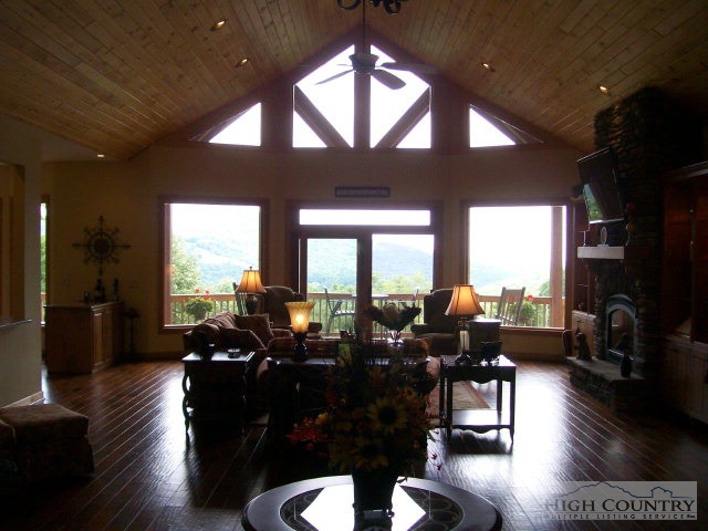 186 Harper Trail Boone, NC 28607 - Photo 44 of 46 a living room with furniture large window and wooden floor