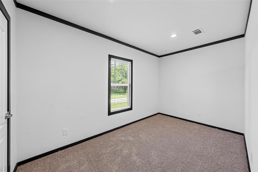 202 6th Street Mount Calm, TX 76673 - Photo 12 of 23 a view of an empty room with a window