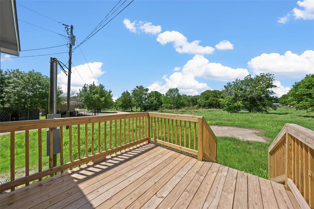 202 6th Street Mount Calm, TX 76673 - Photo 16 of 23 a view of a balcony with wooden floor