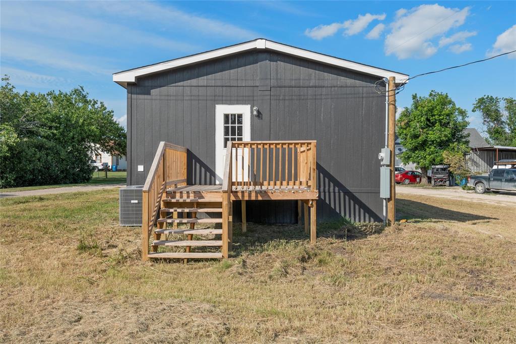 202 6th Street Mount Calm, TX 76673 - Photo 17 of 23 a front view of a house with garden