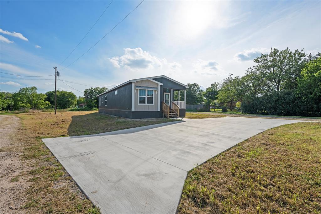 202 6th Street Mount Calm, TX 76673 - Photo 19 of 23 a view of a house with a yard