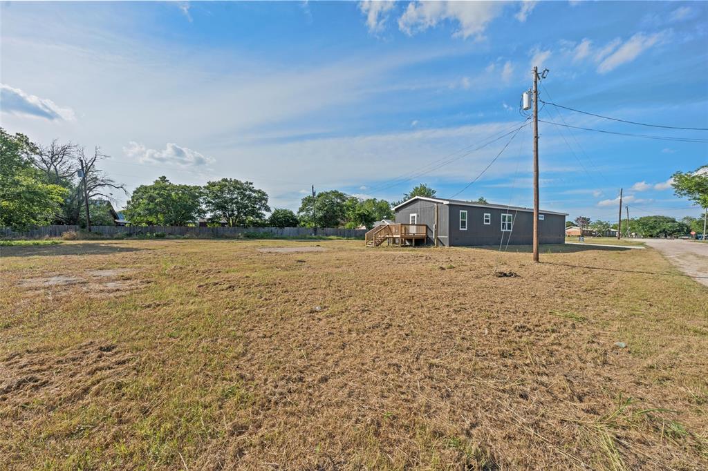 202 6th Street Mount Calm, TX 76673 - Photo 22 of 23 a view of a swimming pool with a yard