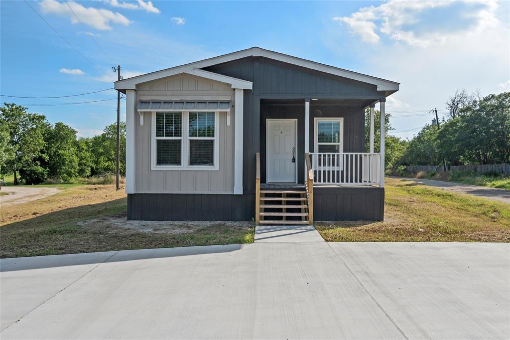 202 6th Street Mount Calm, TX 76673 - Photo 4 of 23 a view of house with porch and wooden fence