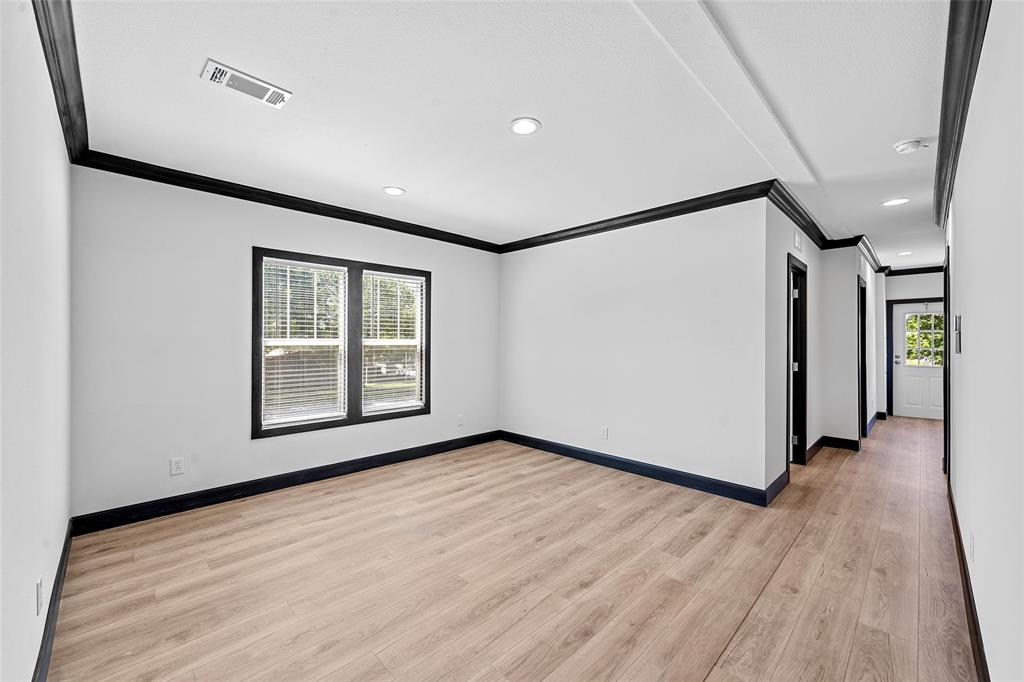 202 6th Street Mount Calm, TX 76673 - Photo 6 of 23 a view of livingroom with hardwood floor and hallway