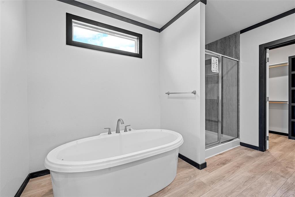 202 6th Street Mount Calm, TX 76673 - Photo 10 of 23 a white bath tub sitting next to a white toilet