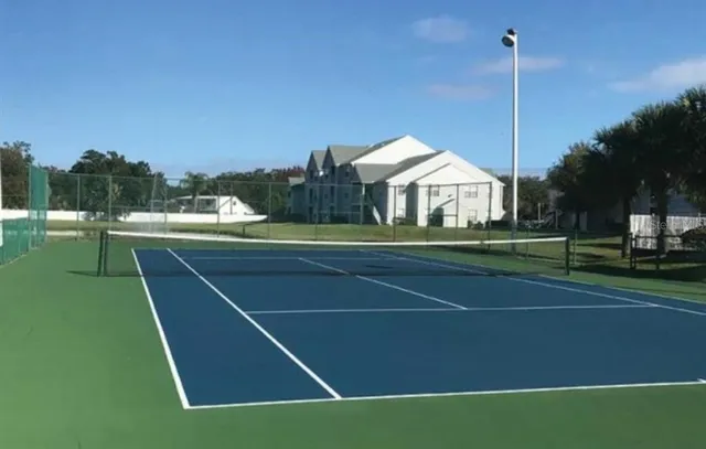 a view of a room with a cabinetry and wooden floor