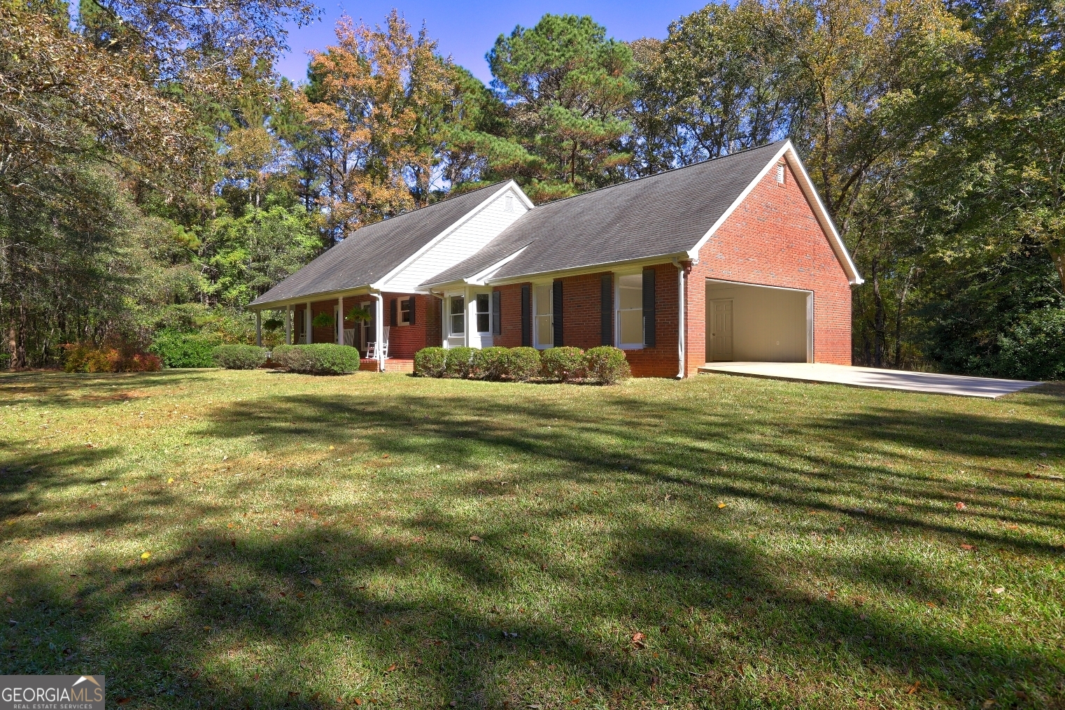 a front view of house with yard and green space